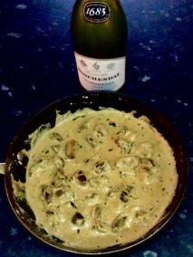 The finished dish in the pan, with a ‘good’ Chardonnay