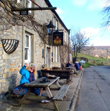 Cheers! Note the sign for fishing tickets. The Wharfe is one of the best fly fishing rivers in the country.